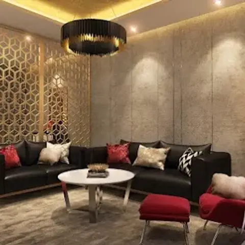 Render of a living room with a gold hexagonal jaali partition screen, a black drum pendant chandelier, a black leather sofa styled with red cushions