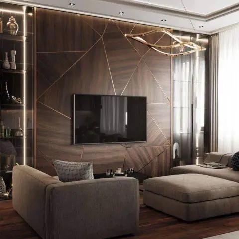 Render of a living room with a geometric dark-wood feature wall inlaid with brass lines, a sculptural wave-form pendant chandelier, and a grey sectional sofa.