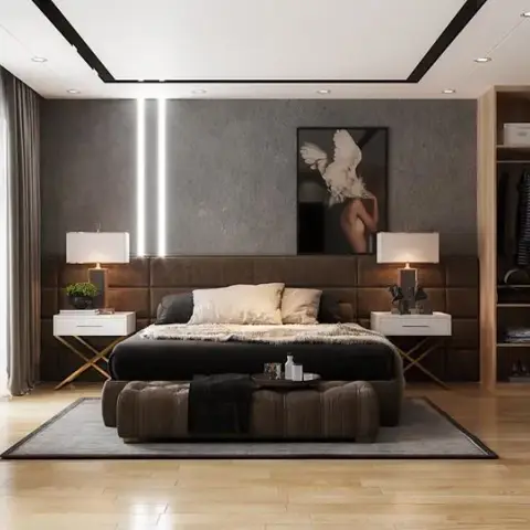 Render of a master bedroom with a brown channel-tufted upholstered headboard wall against a textured concrete-effect accent wall, vertical LED light strips