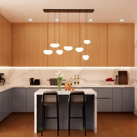 Render of a modern kitchen with oak-veneer upper cabinets, a marble waterfall island, and a cluster of globe pendant lights over bar seating.