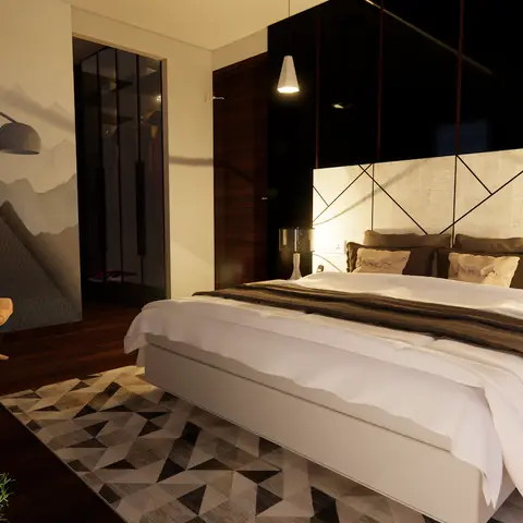 Render of a moodily lit master bedroom with a black glossy panelled wall behind a geometric quilted cream headboard panel