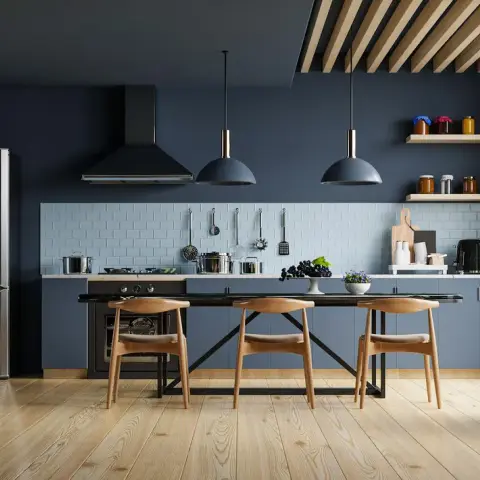 Render of a navy single-wall kitchen — slate-blue matte base units under a black worktop and pale blue metro dado with a hanging utensil rail