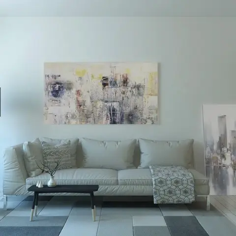 Render of a pale Scandinavian living room: a light grey leather three-seater under a large abstract canvas, a grey egg chair beside a black tripod floor lamp