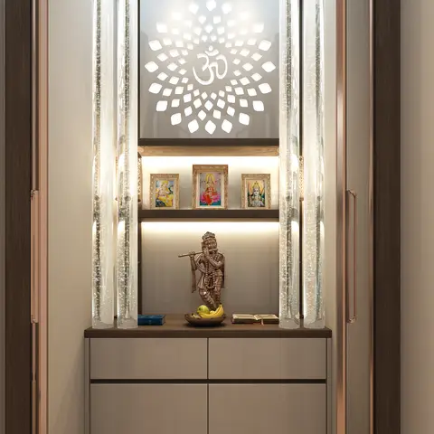 Render of a pooja unit with a backlit Om lotus-motif glass panel, twin bubble-tube pillar lights, a shelf of framed deity portraits, a brass Krishna statue