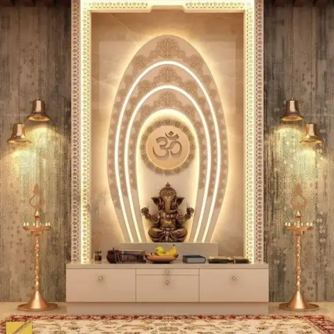 Render of a pooja unit with a backlit arched marble-effect niche framing a Ganesh idol, flanked by brass diya lamps on a textured accent wall.