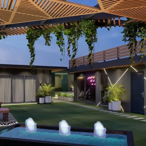 Render of a rooftop terrace at dusk under a triangulated timber pergola dripping with money plant, with an artificial-turf lawn
