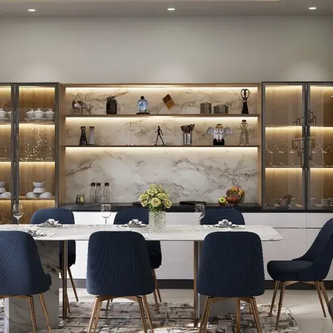 Render of a six-seater dining set in navy fabric chairs on rose-gold legs, facing a marble-backed niche of three backlit open shelves flanked by two