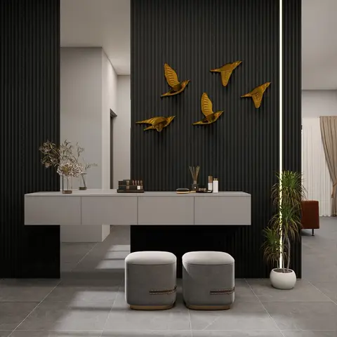 Render of an entrance console area with a black fluted panel wall, a flock of gold bird wall sculptures, a floating console table styled with accessories