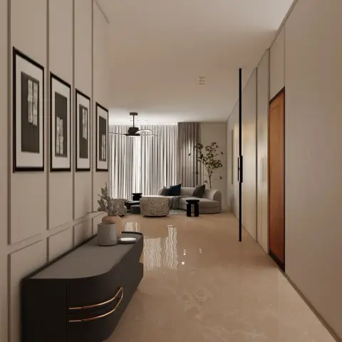 Render of an entry passage lined with ivory moulded wall panels and four black-framed prints, a curved charcoal sideboard on brass legs in the foreground