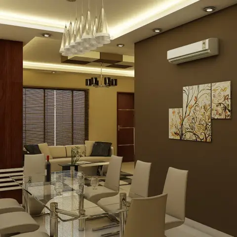 Render of an open dining and living area with a white jaali partition screen, a dark brown accent wall with tree-motif wall art
