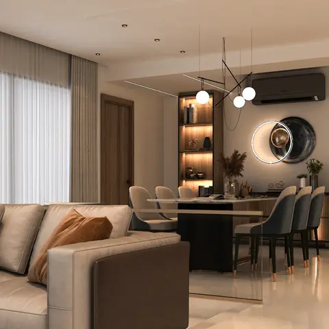 Render of an open living-dining seen across a beige sectional: black-based dining table with slate-blue high-back chairs, a lit walnut display niche