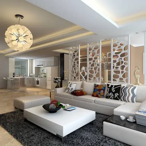 Render of an open living-dining space with a decorative white cellular partition screen dividing the sofa zone from the kitchen