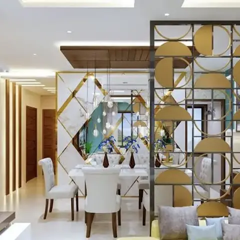 Render of an open living-dining split by a floor-to-ceiling brass screen of overlapping gold discs and mirror