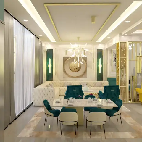 Render of an open-plan living-dining-kitchen space with teal and gold accents, a tufted cream sofa, a marble dining table with teal velvet chairs