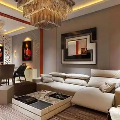 Render of an open-plan living space with a tiered crystal chandelier, a carved white jaali partition screening the dining area, and a cream sectional sofa.