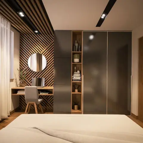 Rendered bedroom with a diagonal wood-slat feature wall behind a round mirror and study desk, a dark grey wardrobe with an open wood display niche