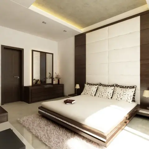 Rendered bedroom with a padded cream headboard panel framed in dark wood, a low platform bed