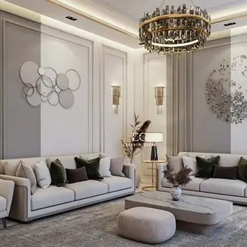 Rendered formal living room with raised gold-trimmed wall panel moulding, a tiered crystal-and-brass chandelier, twin beige sofas