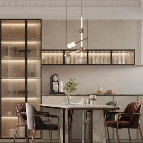 Rendered kitchen-dining space with a marble waterfall-edge round dining table, mixed velvet chairs