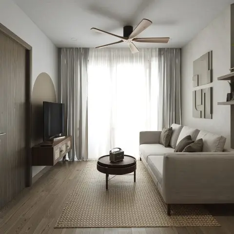 Rendered narrow living room with a beige linen sofa, round wood coffee table, floating wood TV console, and sheer floor-to-ceiling curtains