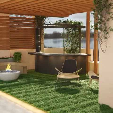 Rooftop terrace under a timber pergola looking over a lake: a lawn floor, a white concrete fire bowl set against a curved stone bench