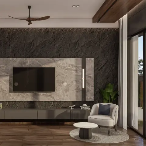 Rough-split charcoal stone wall carrying a floating grey marble TV slab with a slim brass tube light on its right edge, over a long fluted console
