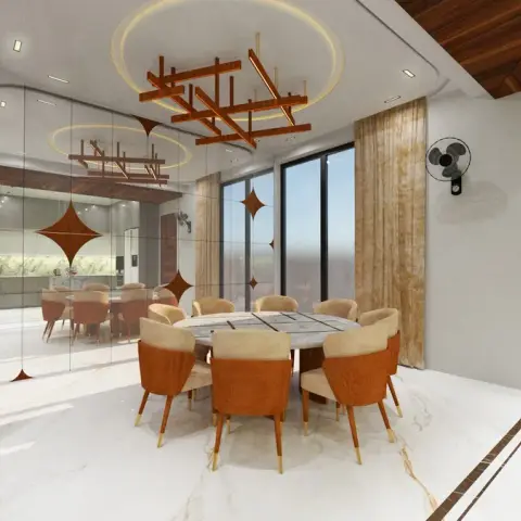 Round marble-top dining table with cognac and cream upholstered chairs beneath a geometric wood-slat pendant light
