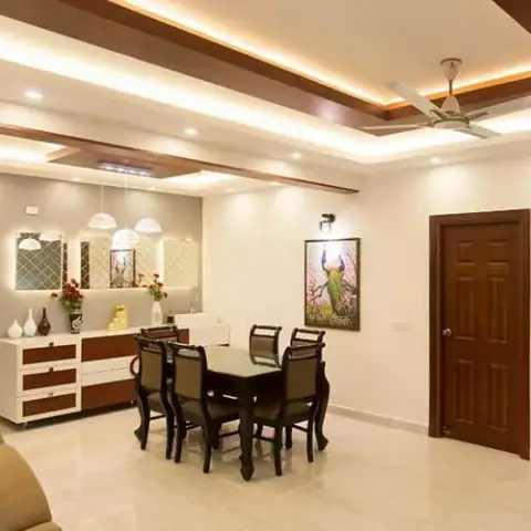 Six-seater dark-wood dining set under a cove-lit false ceiling crossed by teak rafters, with a white-and-walnut sideboard