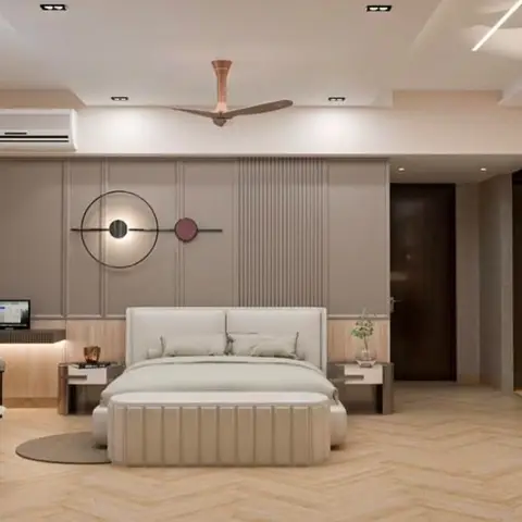Spacious master bedroom with fluted taupe wall panelling behind an upholstered bed, a built-in study nook, and a herringbone wood floor.