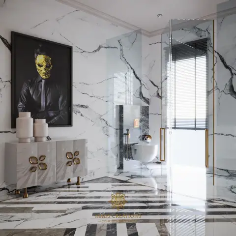 Statuario-clad bathroom with a black-and-white striped marble inlay floor, a brass-framed glass enclosure around the wall-hung WC and shower