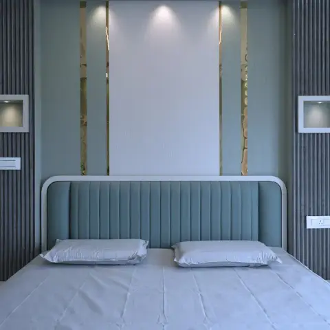 Strictly symmetrical bedroom headboard wall: a teal channel-tufted headboard outlined in a white curved profile