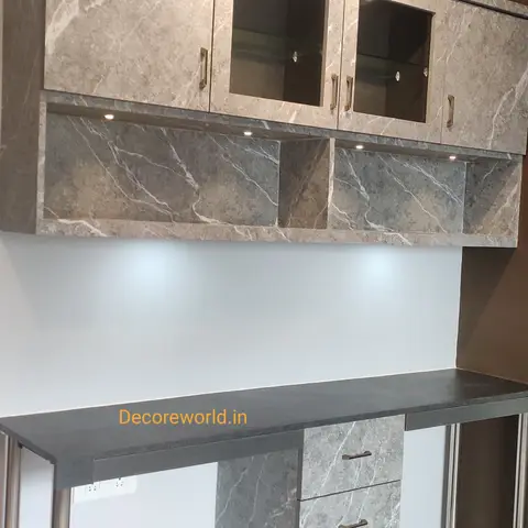 Study desk and matching wall-mounted storage unit in grey marble-effect laminate, glass-front cabinet doors with LED display lighting.