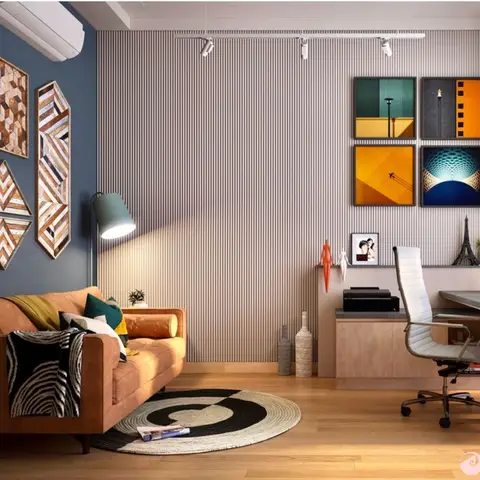 Study with a fluted panel accent wall, a tan leather sofa on a round rug, a gallery wall of colourful art, and a built-in desk with an ergonomic office chair.