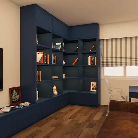 Study with a navy blue corner bookshelf wrapping into a low TV console, a small writing desk with an acrylic ghost chair, and a brown leather sofa.
