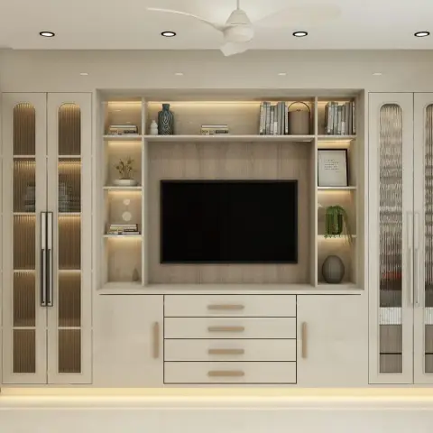 Symmetrical cream wall-to-wall entertainment unit: a wood-grain TV back panel ringed by LED-lit open niches holding books, vases and a trailing plant