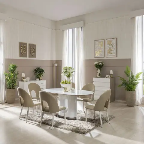Symmetrical dining room with a sculptural white pedestal table, taupe fluted wainscoting