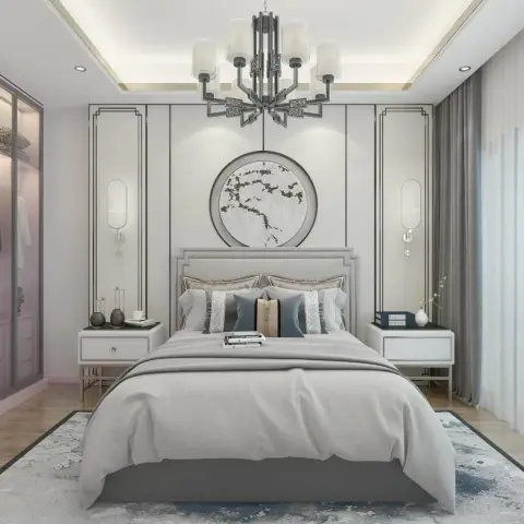 Symmetrical grey bedroom where thin dark inlay lines draw rectangular frames across a pale panelled headboard wall