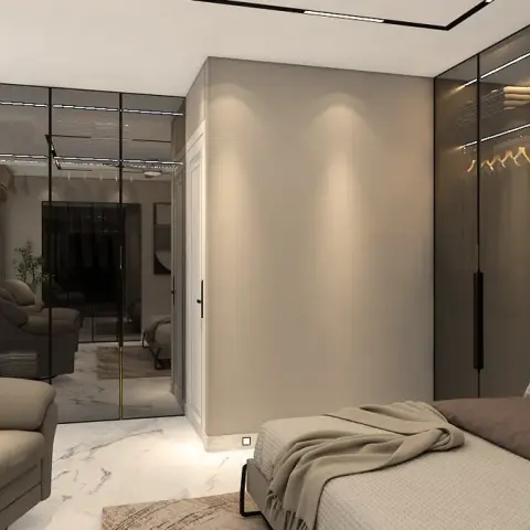 Taupe bedroom where a tinted-glass wardrobe with lit hanging rails runs right up to the bed head