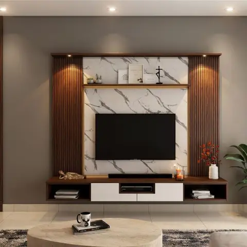 TV feature wall in fluted wood framing a marble backdrop, beside a carved wood jaali partition screening the dining area beyond.