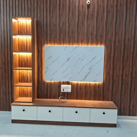 TV feature wall with fluted walnut-finish wood panelling, a backlit white-marble accent panel