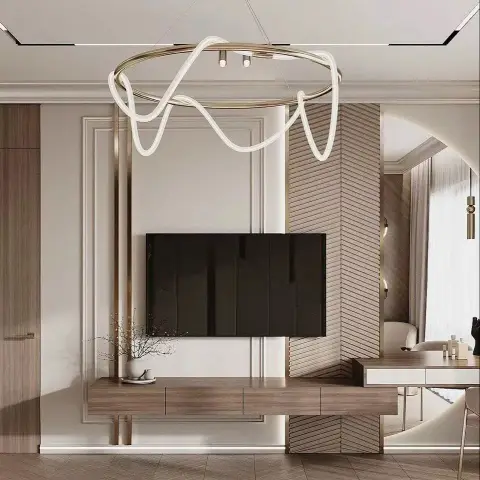 TV wall framed by a slim moulding rectangle and a brass vertical fin, with a chevron-laid slat panel wrapping the return corner