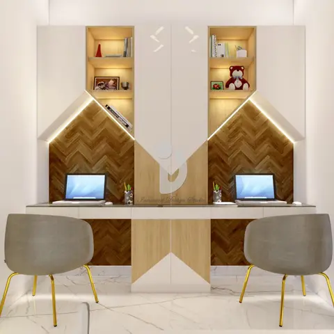 Twin children's study desks with herringbone-pattern wood chevron backsplash panels, open display shelving, and grey shell chairs on brass legs.