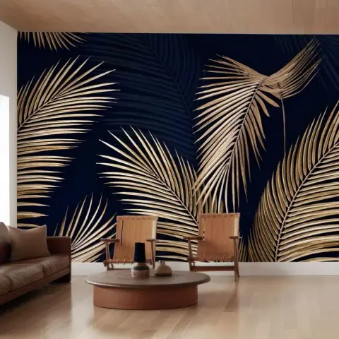 Two leather-sling lounge chairs and a round terracotta drum table set against a wall-wide mural of gold palm fronds on navy, under a pale wood-boarded ceiling.