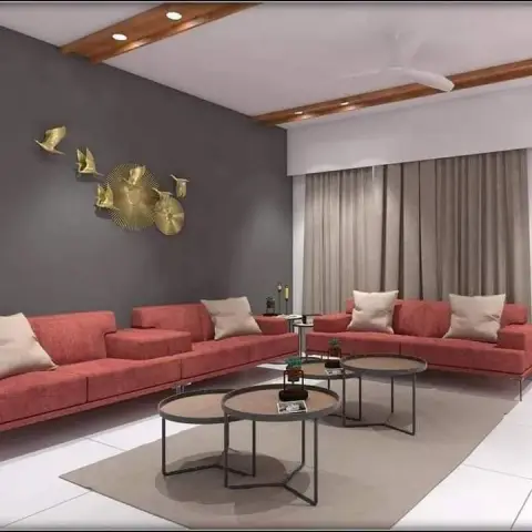 Two long coral fabric sofas facing each other across a cluster of four round nesting tables