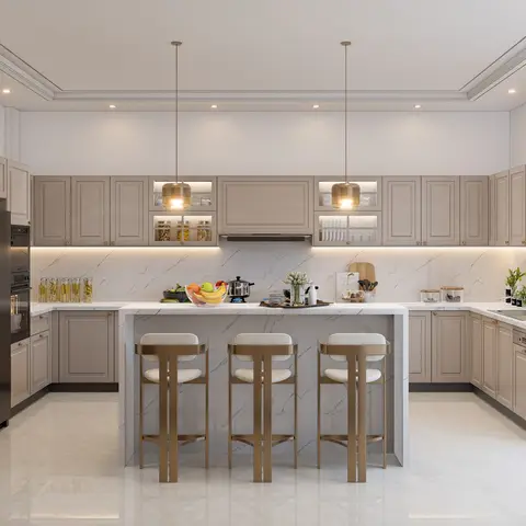 U-shaped kitchen with taupe shaker cabinetry, a marble waterfall island, and brass pendant lights over three bar stools