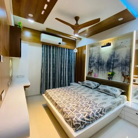 Ultra-wide shot of a bedroom with an angular wood-laminate ceiling and blue LED cove, a platform bed on a wide storage base