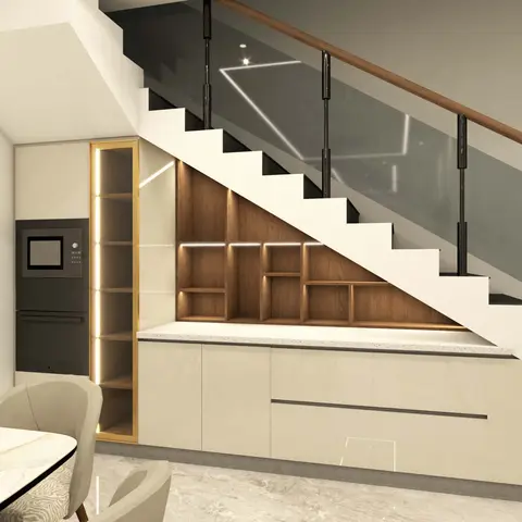 Under-stair kitchen storage with a wall oven, a tall gold-trimmed pantry unit and cove-lit open wooden shelving built into the underside of a glass-railed