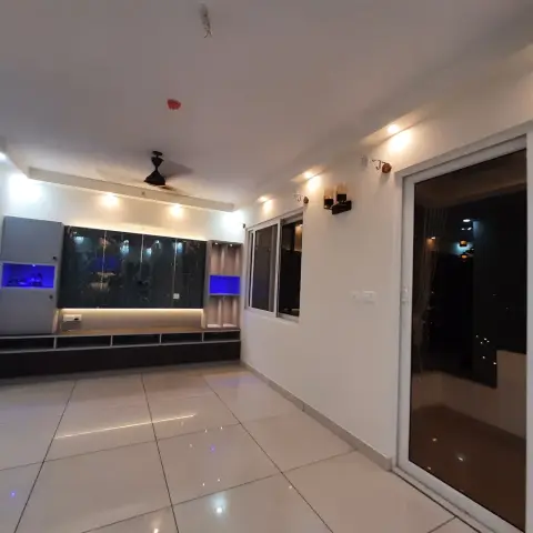 Unfurnished living room with a black marble-effect TV feature wall accented by blue LED display niches, a floating storage console
