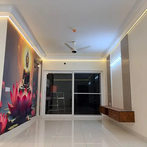 Unfurnished living room with a floor-to-ceiling Buddha-and-lotus mural wall, vertical fluted panelling and a floating wood-finish TV console