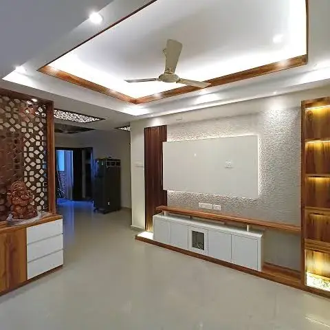 Unfurnished living room with a white laminate TV console under a textured feature panel
